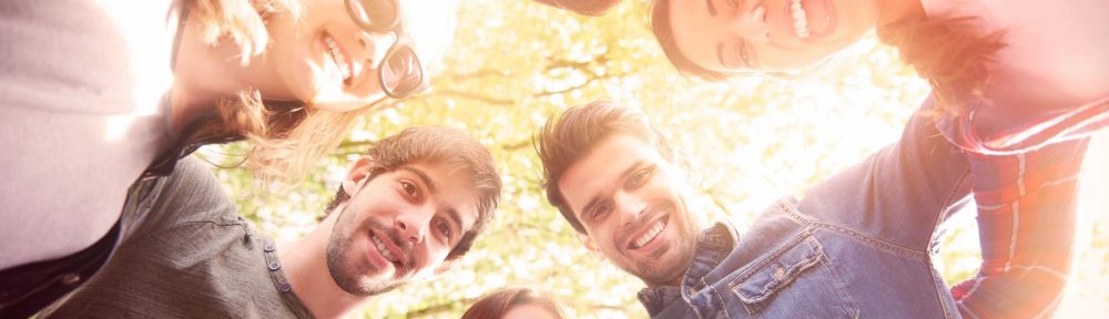 people smiling in a circle