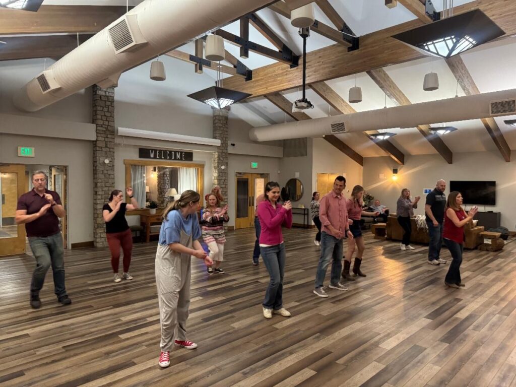 Participants receiving intrustions in line dancing.