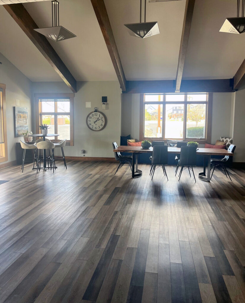 Wheatlands clubhouse interior with high tables and dining table.