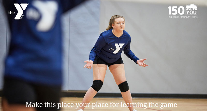 Girl volleyball player in ready stance.