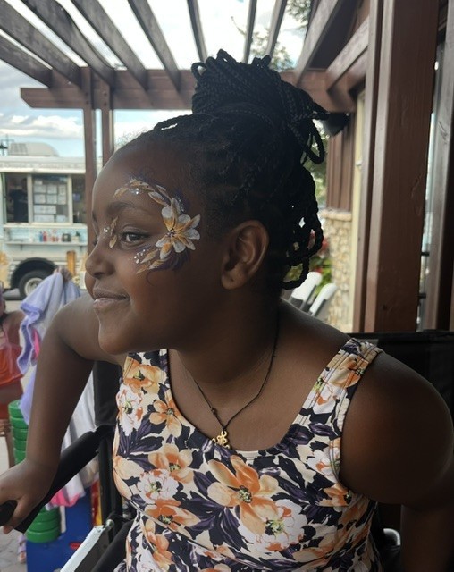 close up of a resident's floral face painting