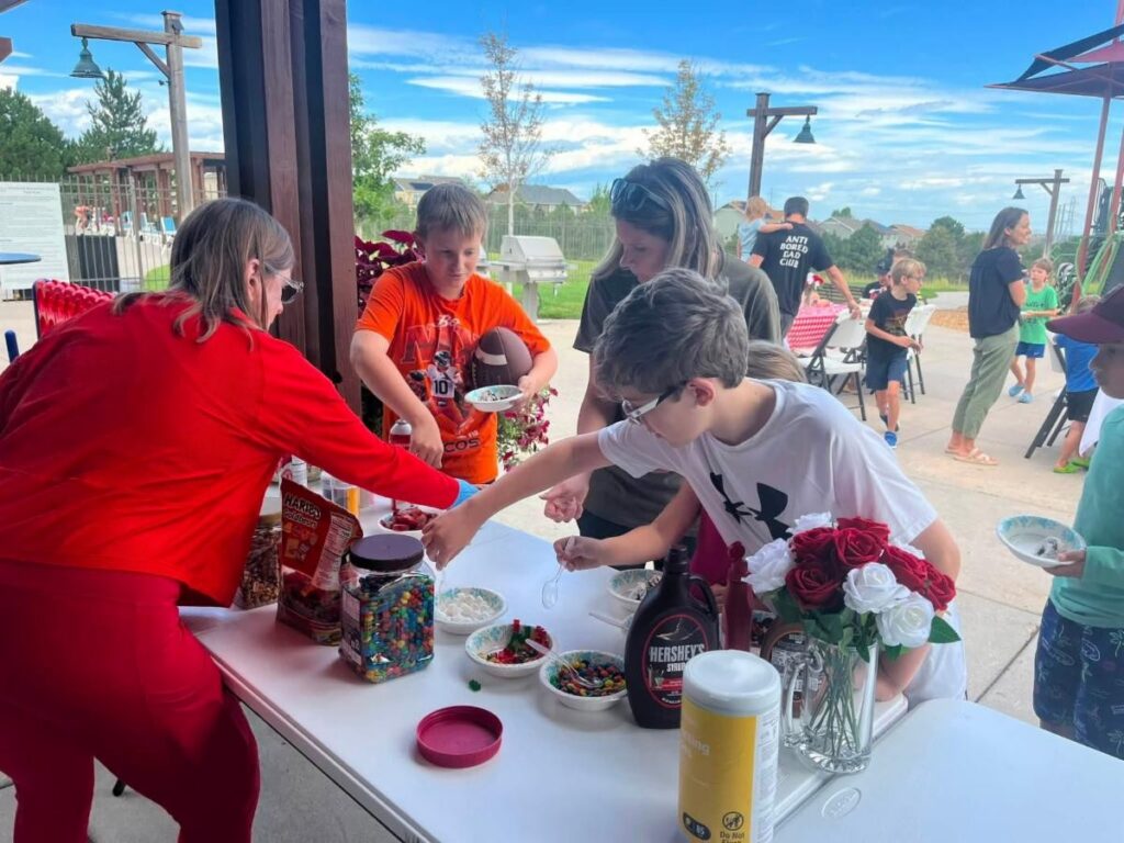 residents making ice cream sundaes