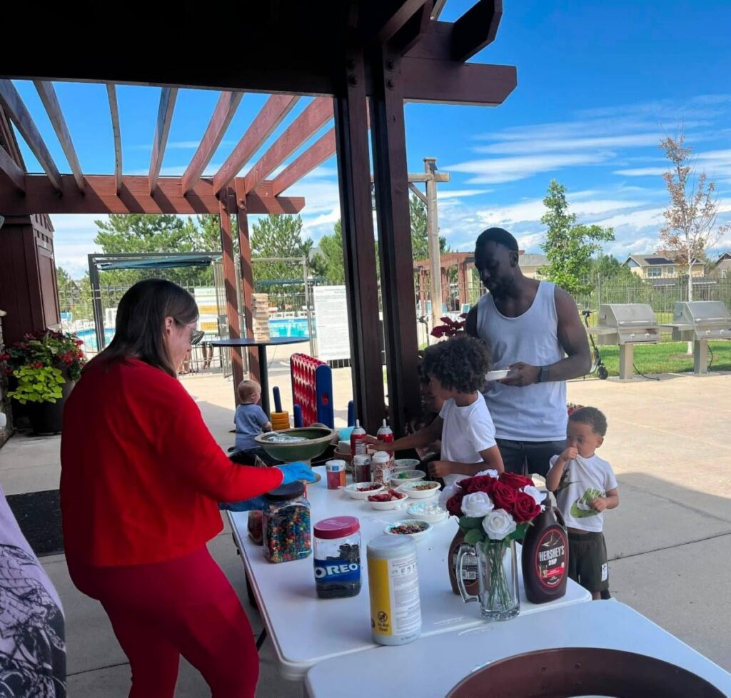 volunteer helping residents select ice cream treats